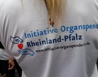 Eine Sportlerin von hinten, auf ihrem Trikot ist das Logo der Initiative Organspende zu sehen.